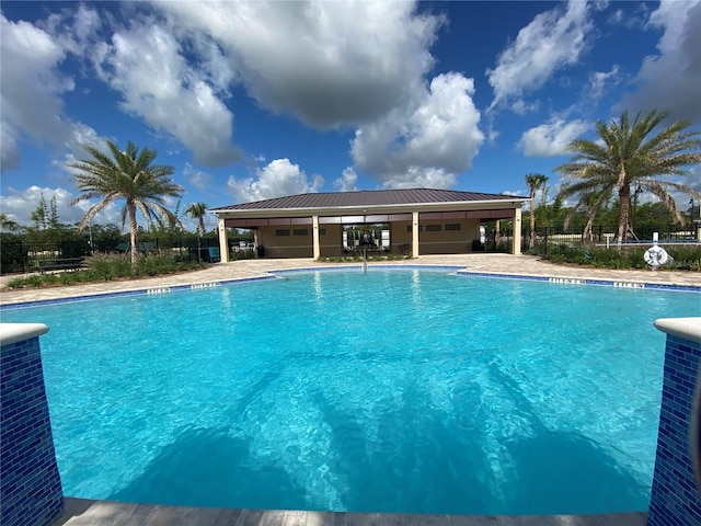 view of swimming pool with cooling unit