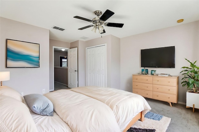 bedroom with ceiling fan, a closet, and carpet