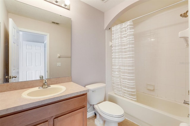 full bathroom featuring shower / bath combination with curtain, vanity, and toilet