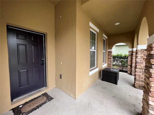 doorway to property with a porch