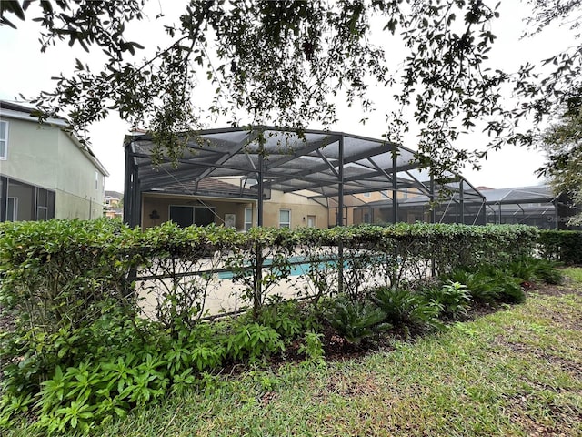 view of pool with a lanai