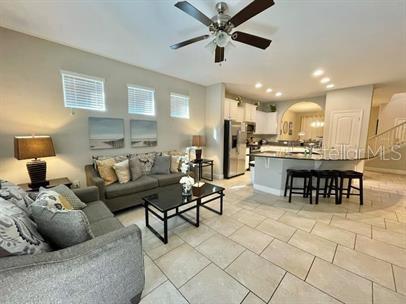 living room with ceiling fan