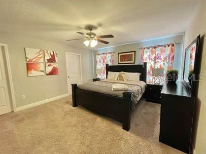 bedroom with light colored carpet and ceiling fan