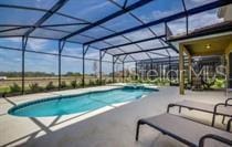 view of pool featuring a patio and a lanai