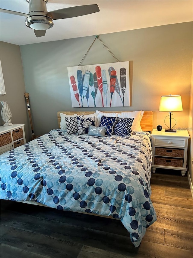 bedroom with wood-type flooring and ceiling fan