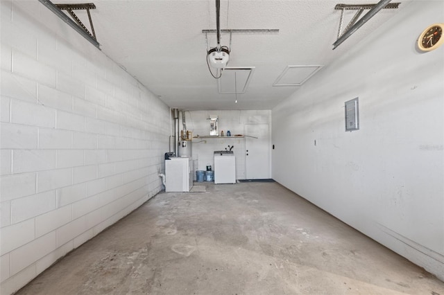 garage featuring a garage door opener and washer and dryer