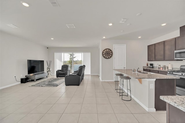 283 Archer Way, Haines City, FL 33844 - living room with sink and light tile patterned flooring