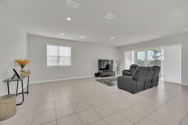 283 Archer Way, Haines City, FL 33844 - living room featuring a healthy amount of sunlight and light tile patterned floors