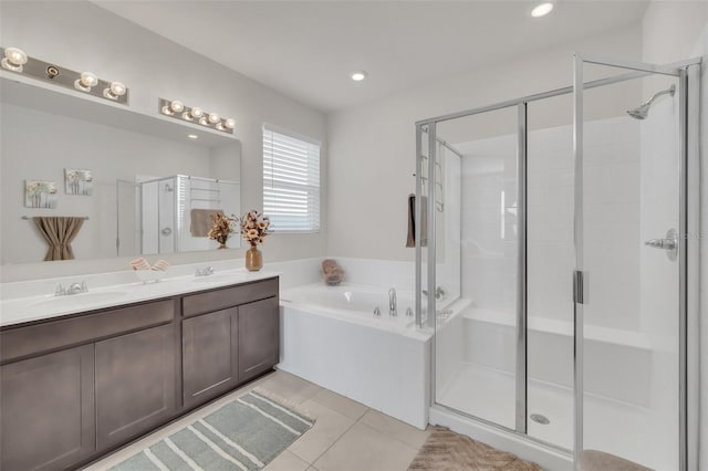 283 Archer Way, Haines City, FL 33844 - bathroom featuring tile patterned flooring, vanity, and separate shower and tub