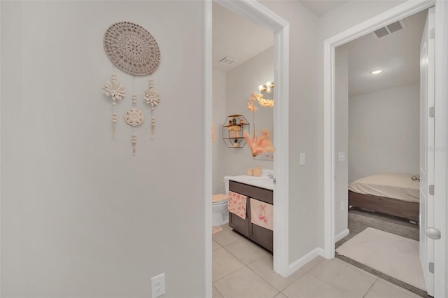 283 Archer Way, Haines City, FL 33844 - bathroom featuring tile patterned flooring, vanity, and toilet