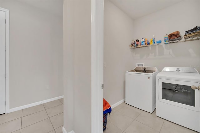 283 Archer Way, Haines City, FL 33844 - laundry area featuring light tile patterned floors and washer and clothes dryer