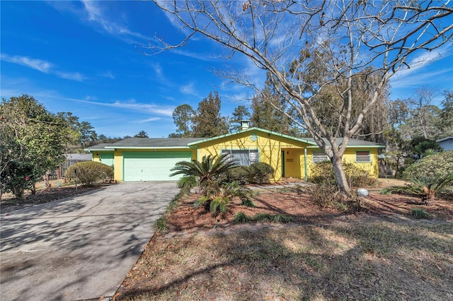 single story home featuring a garage