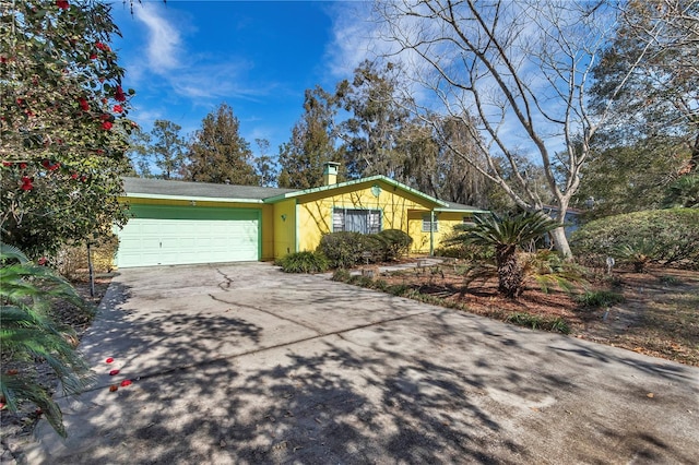 single story home featuring a garage