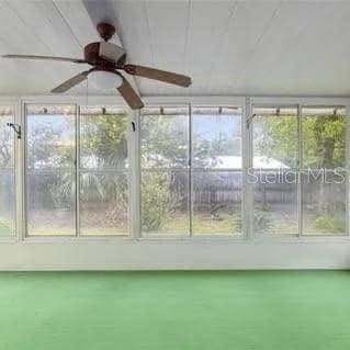 unfurnished sunroom featuring a healthy amount of sunlight