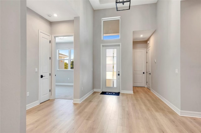 entryway with light hardwood / wood-style floors