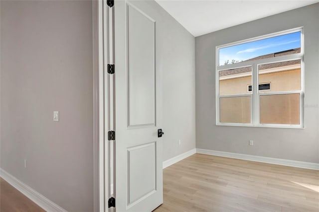 unfurnished room with light hardwood / wood-style flooring