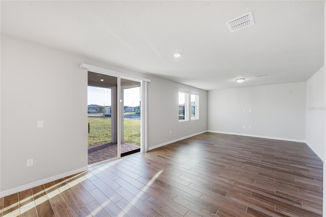 unfurnished room featuring dark wood-type flooring