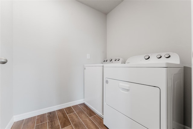 clothes washing area with washer and dryer