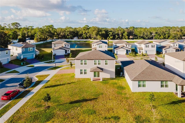 birds eye view of property with a water view