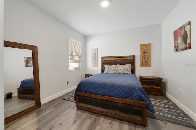 bedroom with light wood-type flooring