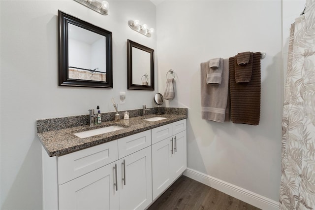 bathroom featuring vanity and hardwood / wood-style flooring