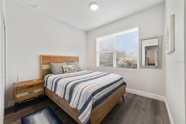 bedroom featuring dark hardwood / wood-style flooring