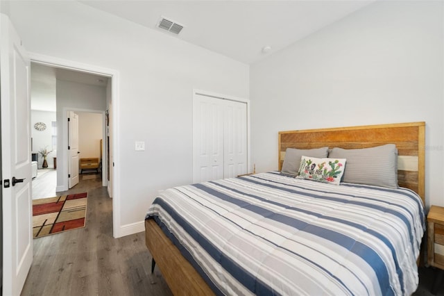 bedroom with light wood-type flooring and a closet