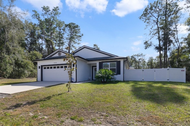 ranch-style home featuring a garage and a front yard