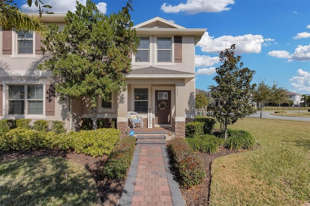 view of front of home with a front lawn