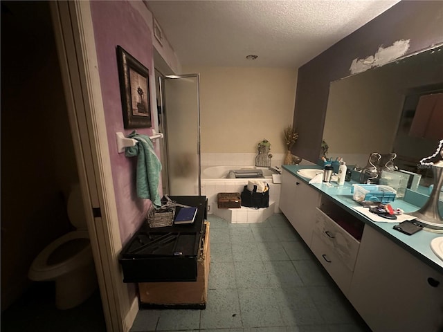 full bathroom with vanity, plus walk in shower, a textured ceiling, and toilet