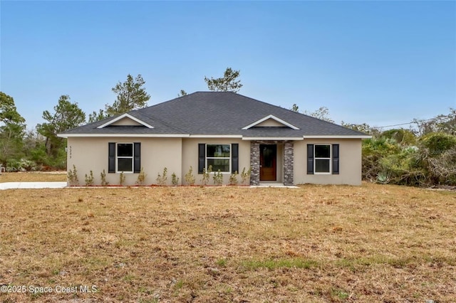 ranch-style home with a front lawn