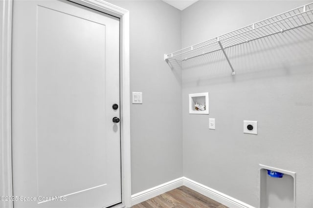 washroom featuring hardwood / wood-style flooring, washer hookup, and hookup for an electric dryer