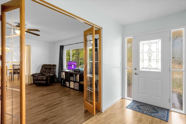 entrance foyer featuring hardwood / wood-style floors, french doors, and ceiling fan