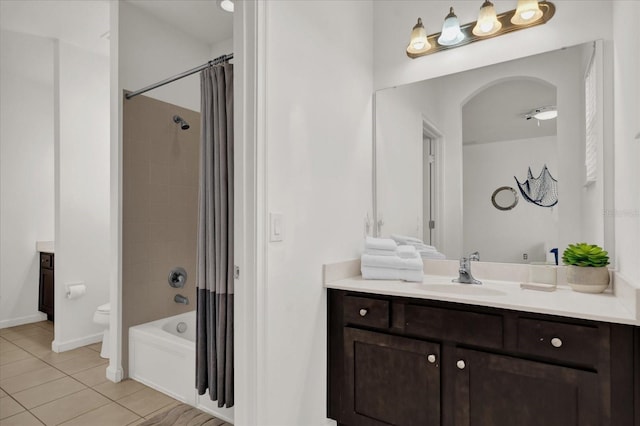 full bathroom with vanity, tile patterned floors, shower / bath combination with curtain, and toilet