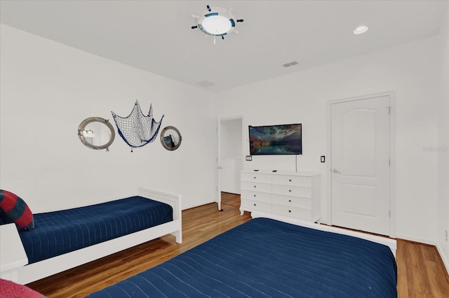 bedroom featuring wood-type flooring