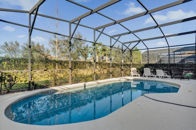 view of pool with a lanai and a patio area