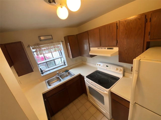 kitchen featuring a sink, under cabinet range hood, light tile patterned flooring, white appliances, and light countertops