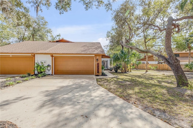 single story home featuring a front yard