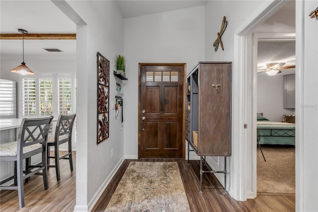 foyer entrance with hardwood / wood-style floors