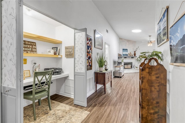 hall with hardwood / wood-style flooring