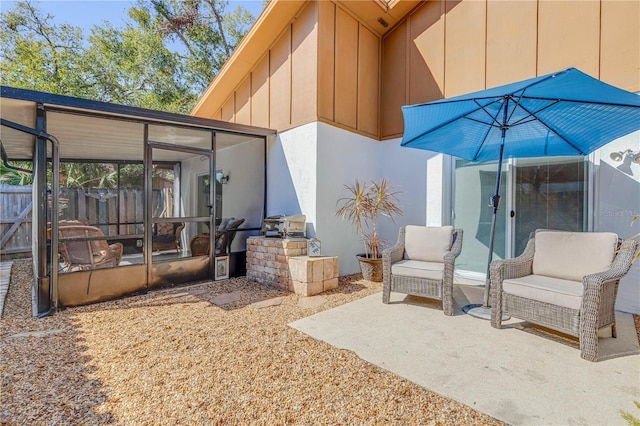 view of patio with a sunroom