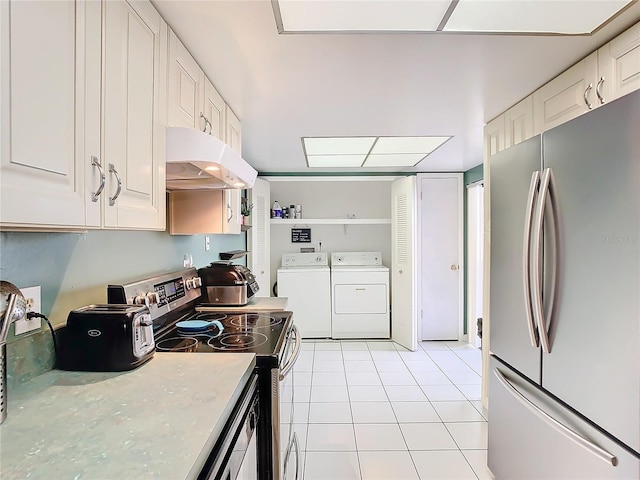 kitchen featuring white cabinetry, light tile patterned floors, washer and clothes dryer, and appliances with stainless steel finishes