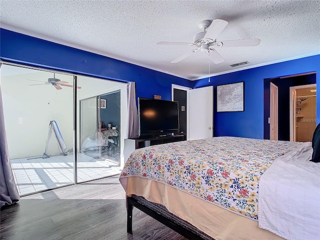 bedroom with a closet, ceiling fan, hardwood / wood-style floors, and a textured ceiling