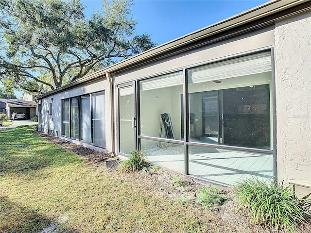 view of side of property with a yard