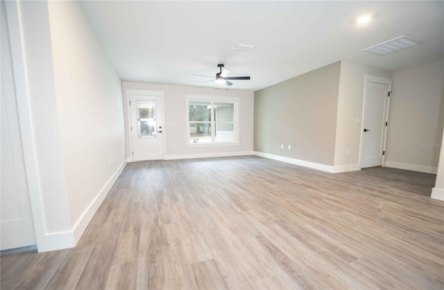 empty room with ceiling fan and light wood-type flooring