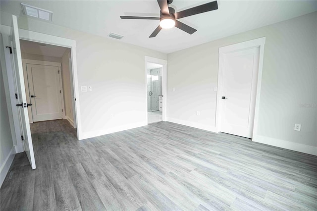 unfurnished bedroom featuring hardwood / wood-style floors and ceiling fan