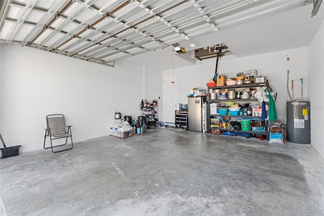 garage with a garage door opener and electric water heater