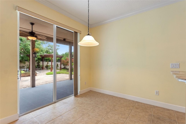 interior space with ornamental molding, light tile patterned flooring, and ceiling fan