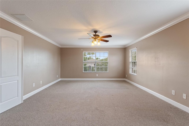 carpeted empty room with crown molding, ceiling fan, and a textured ceiling