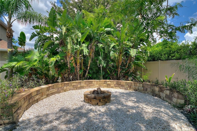 view of patio with a fire pit